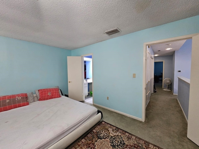 9807 Bent Branch Ln, Dallas, TX 75243 - bedroom with carpet floors, baseboards, and a textured ceiling
