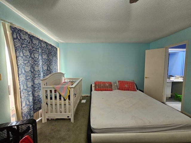9807 Bent Branch Ln, Dallas, TX 75243 - carpeted bedroom featuring a textured ceiling