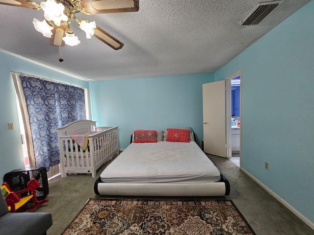 9807 Bent Branch Ln, Dallas, TX 75243 - bedroom featuring carpet floors, a textured ceiling, and a ceiling fan