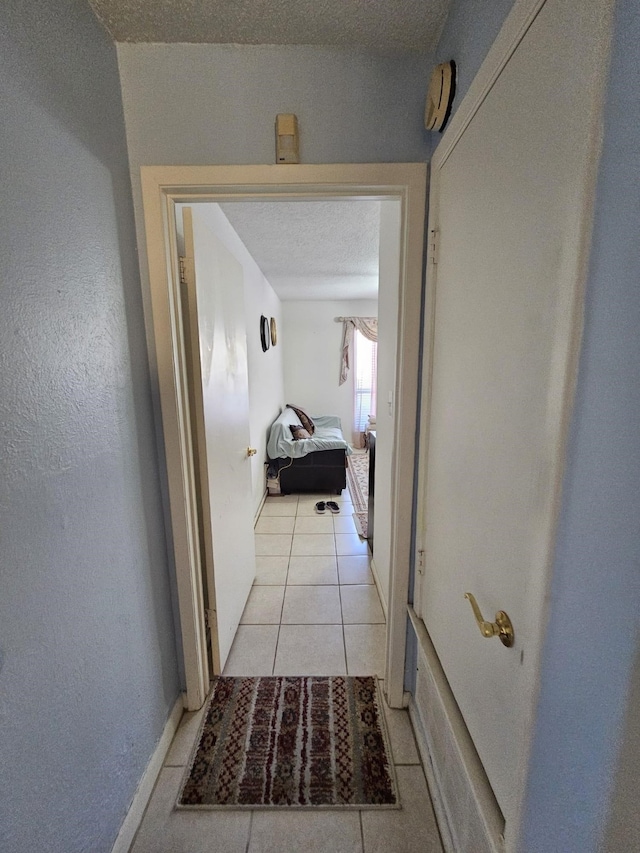 9807 Bent Branch Ln, Dallas, TX 75243 - corridor with light tile patterned flooring