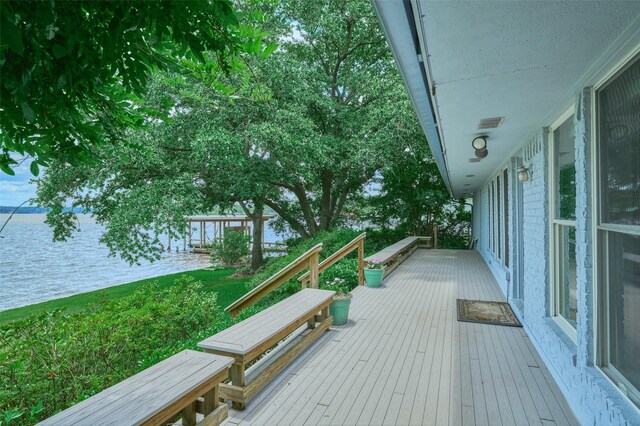 1378 Landing Way, Trinity, TX 75862 - deck with a water view and a lawn