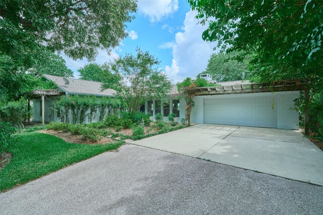 1378 Landing Way, Trinity, TX 75862 - view of front of property with concrete driveway, a garage, and brick siding