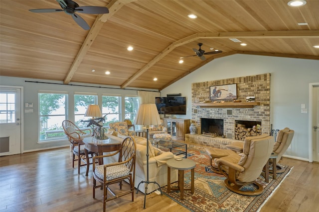 1378 Landing Way, Trinity, TX 75862 - living room with a ceiling fan, wooden ceiling, hardwood / wood-style flooring, plenty of natural light, and a brick fireplace