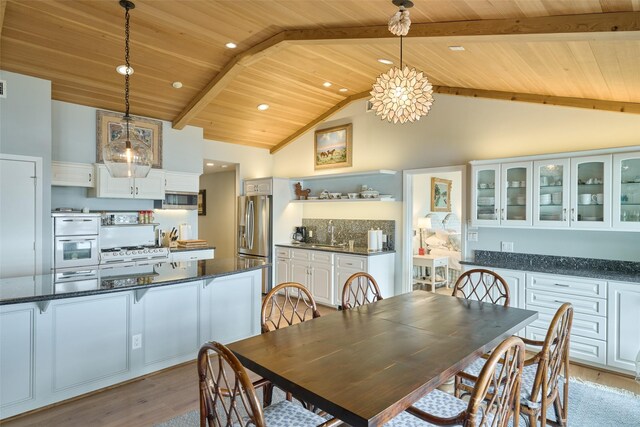 1378 Landing Way, Trinity, TX 75862 - dining area featuring wooden ceiling, light wood-type flooring, high vaulted ceiling, recessed lighting, and beam ceiling