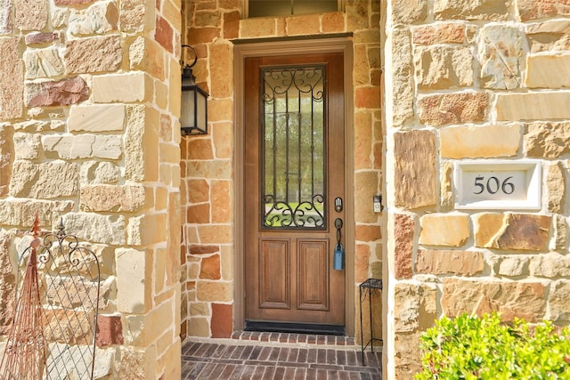 506 Chirping Sparrow Ct, Pinehurst, TX 77362 - property entrance featuring stone siding and brick siding