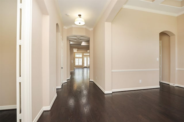 506 Chirping Sparrow Ct, Pinehurst, TX 77362 - hall with arched walkways, dark wood finished floors, crown molding, and baseboards