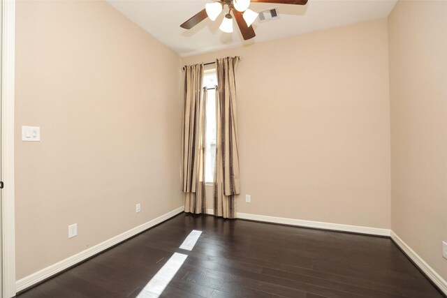 506 Chirping Sparrow Ct, Pinehurst, TX 77362 - unfurnished room featuring ceiling fan, dark wood-type flooring, and baseboards