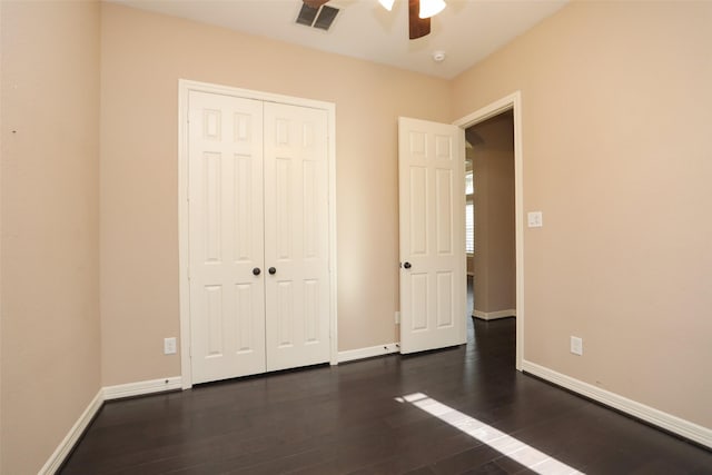 506 Chirping Sparrow Ct, Pinehurst, TX 77362 - unfurnished bedroom featuring wood finished floors, baseboards, a closet, and a ceiling fan