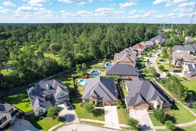506 Chirping Sparrow Ct, Pinehurst, TX 77362 - aerial perspective of suburban area featuring a forest