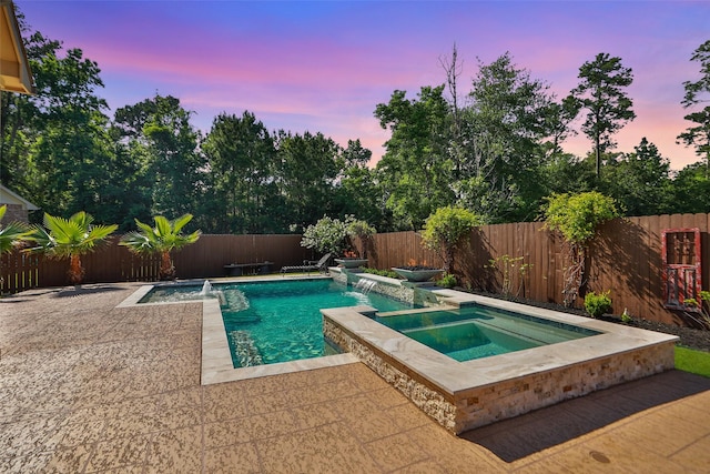 506 Chirping Sparrow Ct, Pinehurst, TX 77362 - view of pool with a pool with connected hot tub, a fenced backyard, and a patio