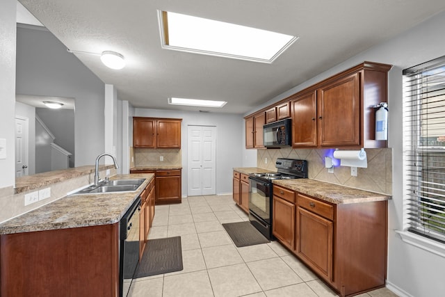 8414 Coriander Ln, Baytown, TX 77521 - kitchen featuring black appliances, a sink, backsplash, light tile patterned floors, and brown cabinets