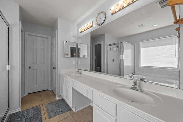 8414 Coriander Ln, Baytown, TX 77521 - full bath with tile patterned flooring, a shower stall, double vanity, and a bathtub
