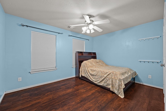 8414 Coriander Ln, Baytown, TX 77521 - bedroom with wood finished floors, ceiling fan, and baseboards