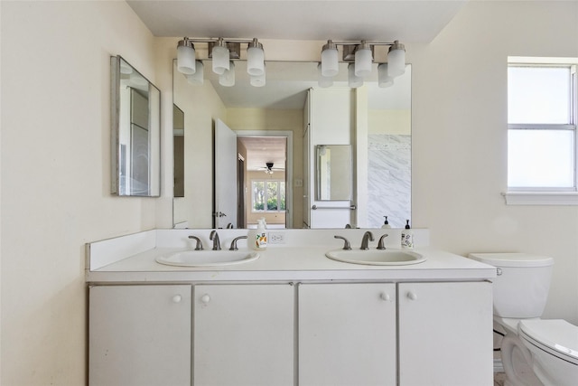 2368 Old Columbus Rd N, Sealy, TX 77474 - full bathroom featuring toilet and double vanity