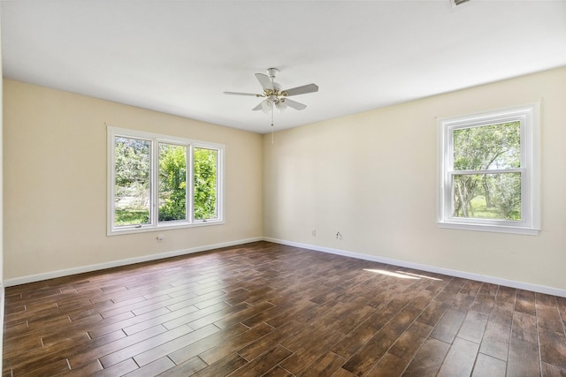 2368 Old Columbus Rd N, Sealy, TX 77474 - spare room with ceiling fan, baseboards, and dark wood finished floors