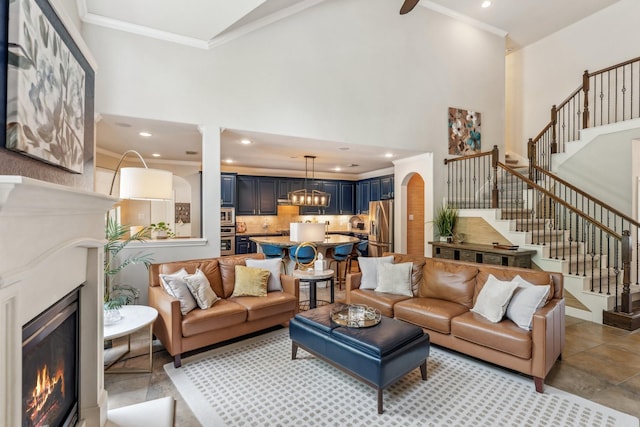 15730 Hunters Lake Way, Houston, TX 77044 - living area with a glass covered fireplace, stairway, high vaulted ceiling, recessed lighting, and arched walkways
