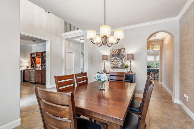 15730 Hunters Lake Way, Houston, TX 77044 - dining area with arched walkways, light tile patterned floors, baseboards, a chandelier, and beverage cooler