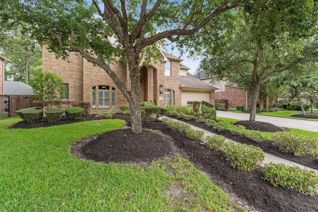 15730 Hunters Lake Way, Houston, TX 77044 - view of front of house featuring brick siding, a garage, driveway, and a front lawn