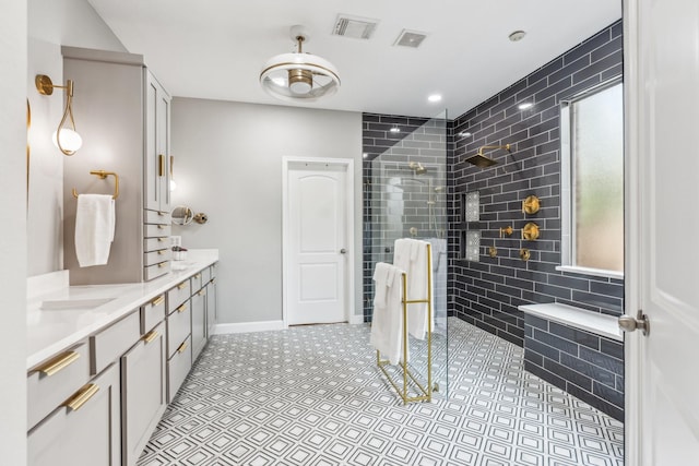 15730 Hunters Lake Way, Houston, TX 77044 - bathroom featuring walk in shower, double vanity, and baseboards