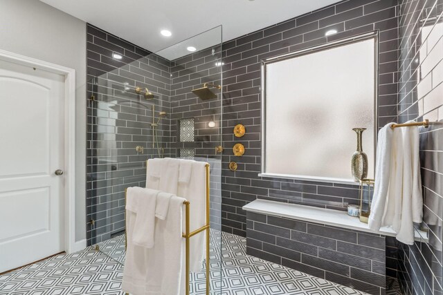 15730 Hunters Lake Way, Houston, TX 77044 - bathroom with tile walls, a walk in shower, recessed lighting, and tile patterned flooring