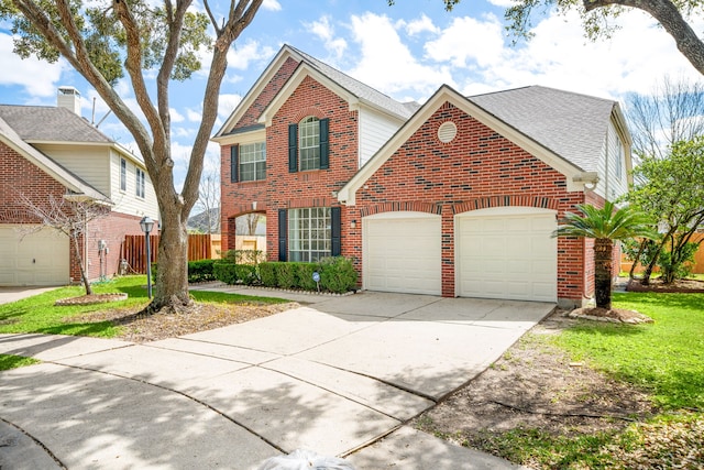 3815 Shadow Knoll Ct, Houston, TX 77082 - traditional-style home featuring brick siding, an attached garage, concrete driveway, and fence
