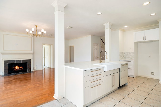 3815 Shadow Knoll Ct, Houston, TX 77082 - kitchen with a sink, recessed lighting, crown molding, white cabinetry, and tasteful backsplash