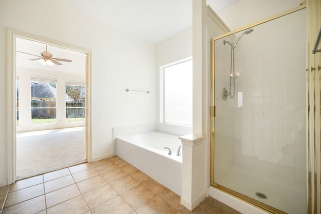 3815 Shadow Knoll Ct, Houston, TX 77082 - bathroom with a stall shower, a garden tub, tile patterned floors, baseboards, and ceiling fan