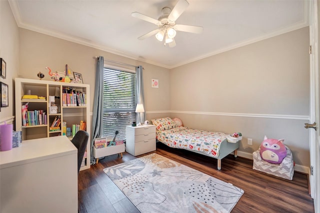 bedroom with wood finished floors, ornamental molding, ceiling fan, and baseboards