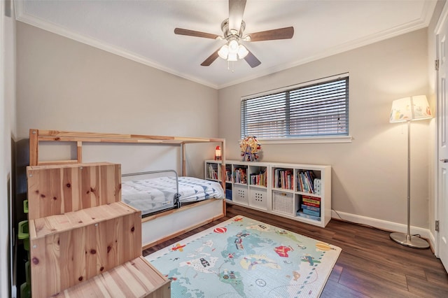 bedroom featuring crown molding, wood finished floors, baseboards, and a ceiling fan