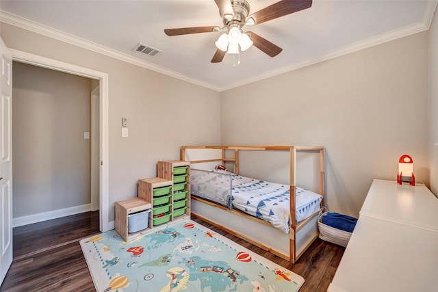 bedroom featuring wood finished floors, crown molding, baseboards, and ceiling fan