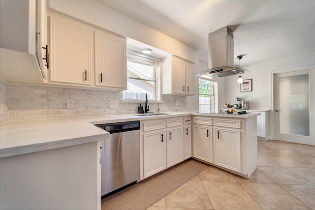 kitchen with stainless steel dishwasher, island exhaust hood, a sink, a peninsula, and decorative backsplash
