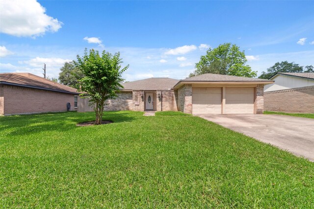 21603 Slippery Creek Ln, Spring, TX 77388 - ranch-style home featuring brick siding, a front lawn, driveway, and a garage
