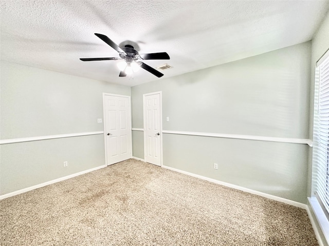 10614 Gold Point Dr, Houston, TX 77064 - carpeted empty room featuring ceiling fan, a textured ceiling, and baseboards