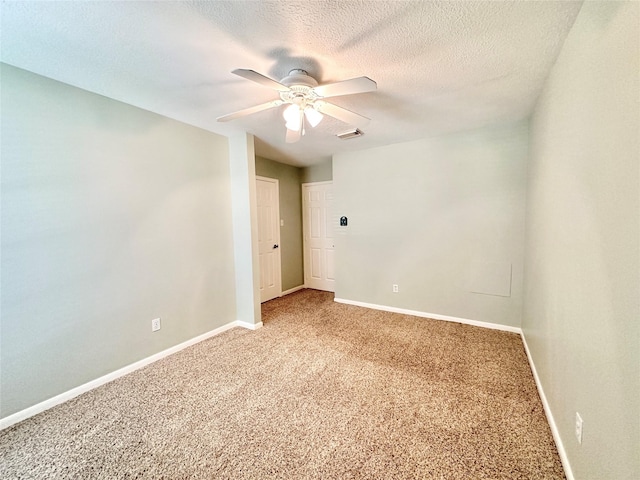 10614 Gold Point Dr, Houston, TX 77064 - spare room featuring light colored carpet, baseboards, a ceiling fan, and a textured ceiling