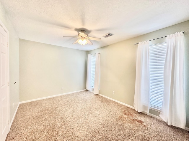 10614 Gold Point Dr, Houston, TX 77064 - spare room with light carpet, a ceiling fan, and baseboards