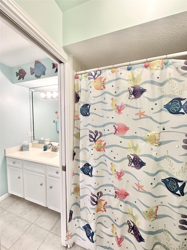 10614 Gold Point Dr, Houston, TX 77064 - bathroom with vanity, a textured ceiling, tile patterned flooring, and curtained shower
