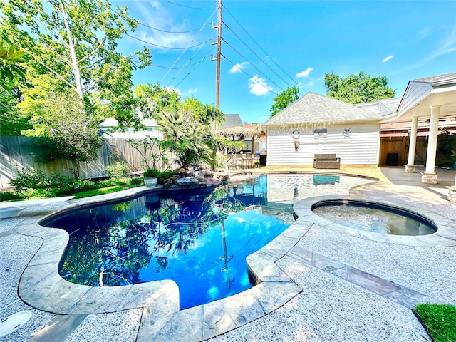 10614 Gold Point Dr, Houston, TX 77064 - view of swimming pool featuring an in-ground hot tub, a fenced backyard, and a patio area
