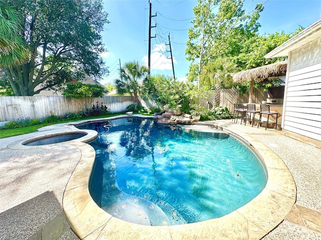 10614 Gold Point Dr, Houston, TX 77064 - view of swimming pool with a fenced backyard, a patio, and a pool with connected hot tub