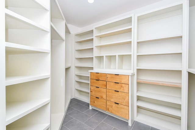 23210 Greenrush Dr, Katy, TX 77494 - spacious closet featuring dark tile patterned flooring
