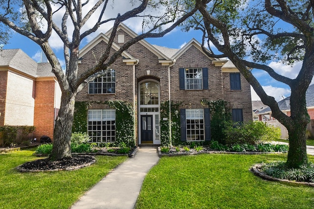 23210 Greenrush Dr, Katy, TX 77494 - traditional-style house with brick siding and a front lawn
