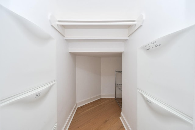 23210 Greenrush Dr, Katy, TX 77494 - walk in closet featuring wood finished floors