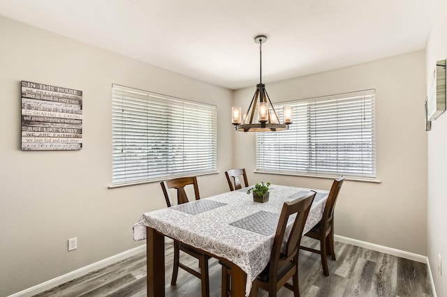 24610 Long Trail Ln, Houston, TX 77336 - dining area with a chandelier, baseboards, and wood finished floors