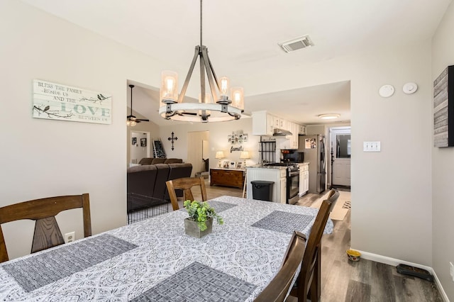 24610 Long Trail Ln, Houston, TX 77336 - dining space featuring a chandelier, wood finished floors, and baseboards