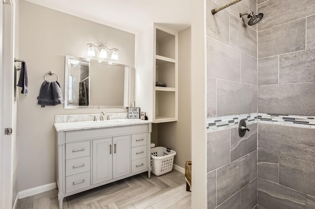 24610 Long Trail Ln, Houston, TX 77336 - bathroom with a tile shower, vanity, and baseboards