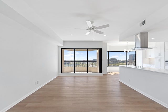 2001 Holcombe Blvd Unit 1605, Houston, TX 77030 - unfurnished living room with a ceiling fan, light wood-type flooring, baseboards, and recessed lighting