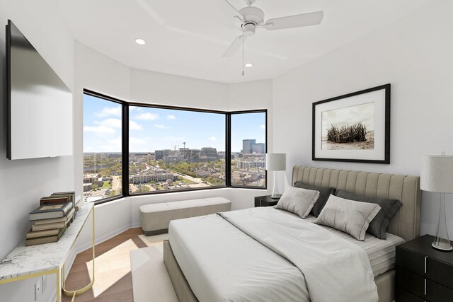 2001 Holcombe Blvd Unit 1605, Houston, TX 77030 - bedroom featuring a city view, light wood-style floors, recessed lighting, and a ceiling fan