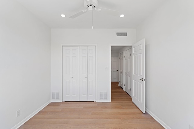 2001 Holcombe Blvd Unit 1605, Houston, TX 77030 - unfurnished bedroom featuring light wood-type flooring, recessed lighting, a closet, baseboards, and a ceiling fan