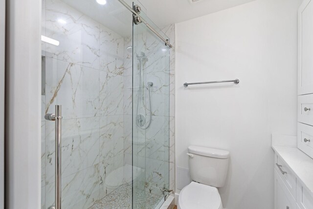 2001 Holcombe Blvd Unit 1605, Houston, TX 77030 - full bath featuring a marble finish shower, toilet, and vanity
