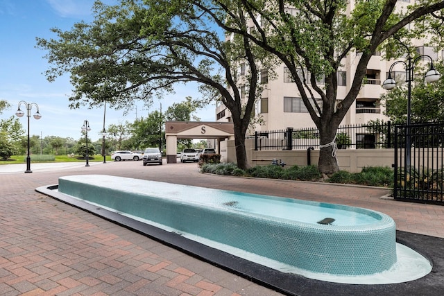 2001 Holcombe Blvd Unit 1605, Houston, TX 77030 - view of swimming pool with fence