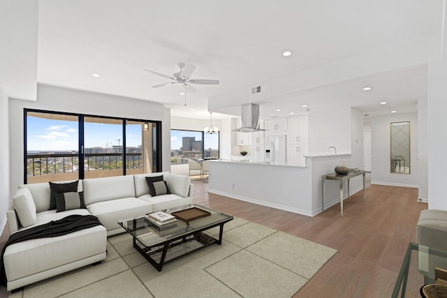 2001 Holcombe Blvd Unit 1605, Houston, TX 77030 - living area featuring ceiling fan, light wood-style flooring, recessed lighting, and baseboards